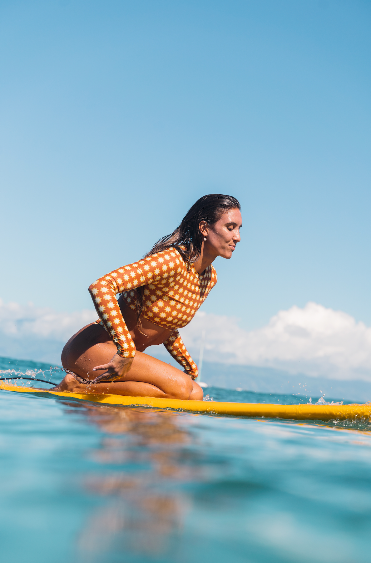 Women wearing brown sustainable surfing swim set womens sustainable swimwear made for surfing, recycled plastic swimwear, eco friendly